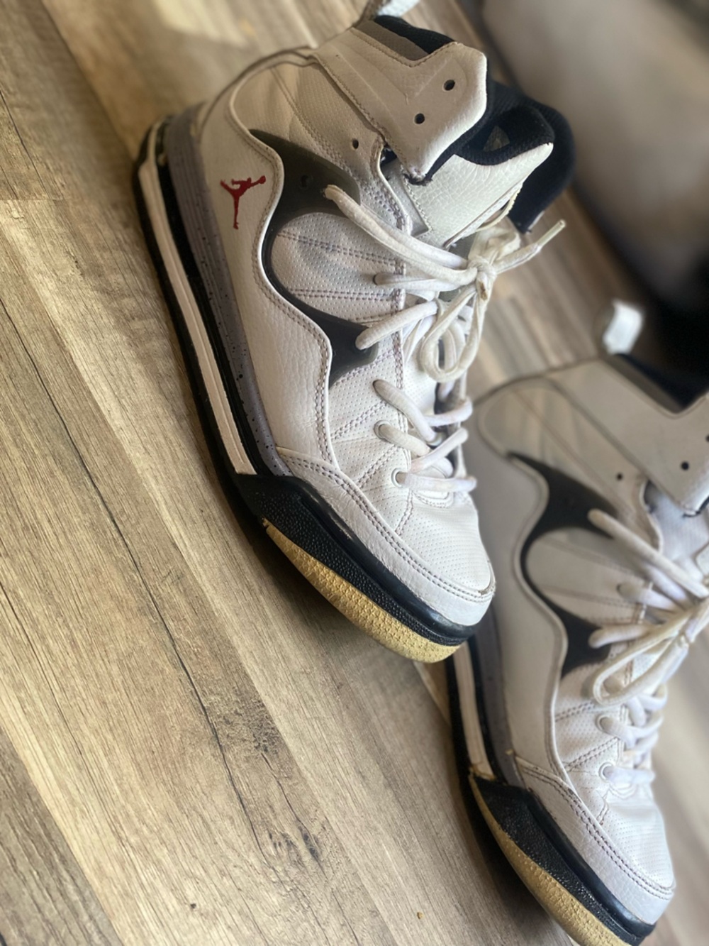 Jordan White and Black High-Top Sneakers with Red Jumpman Accent